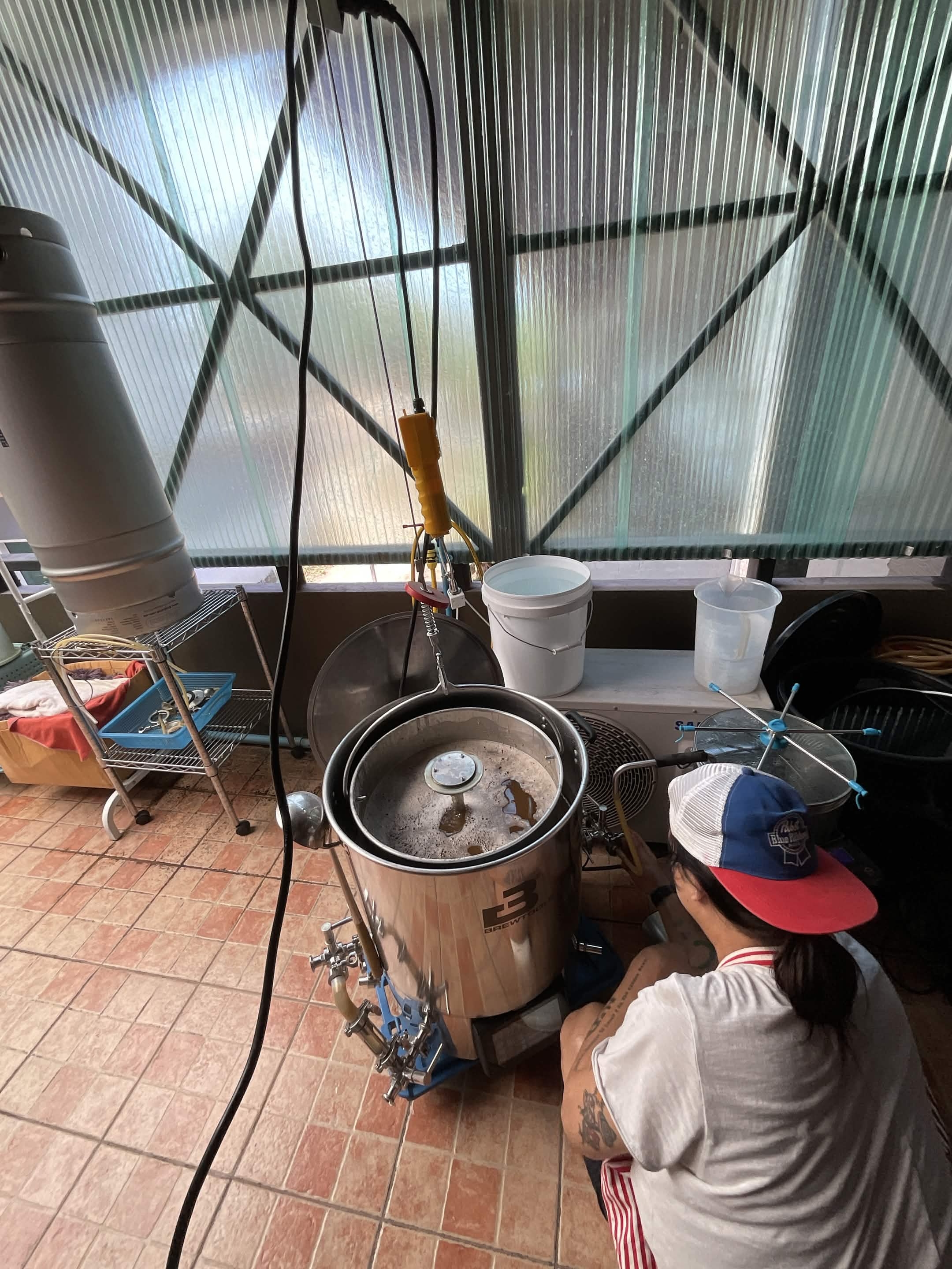 Grain pipe suspended above kettle